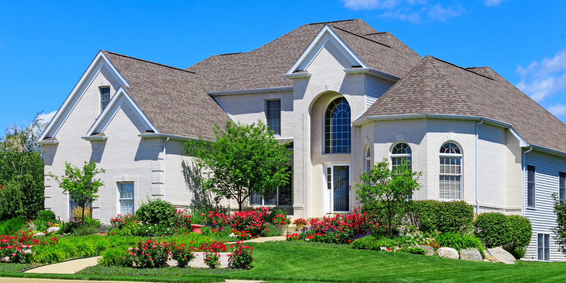 Traditional brick home with a fresh architectural shingle roof